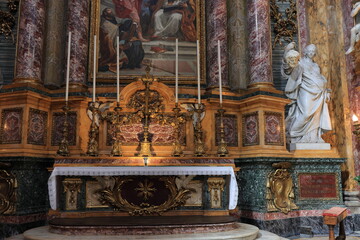 Fototapeta na wymiar Santi Ambrogio e Carlo al Corso Altar View with Statue in Rome, Italy