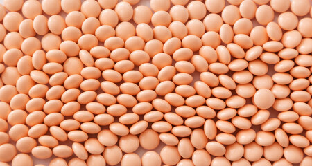 Pink pills background. Vitamins and supplements for healthy skin. Internet pharmacy. 