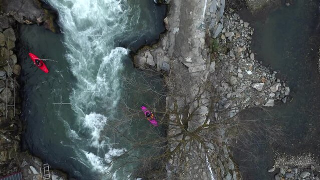 Aerial 90 degrees view of kayakers train in artificial stream. Dora view. Video, Real time 4K