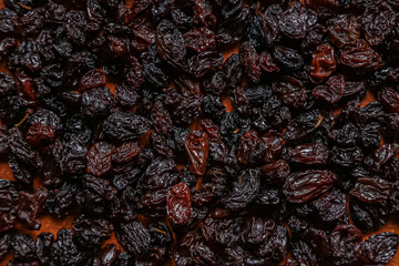 background texture raisins dried grapes on a dark background