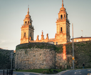 Fototapeta na wymiar The bimillennial Roman wall and the Romanesque cathedral in Lugo