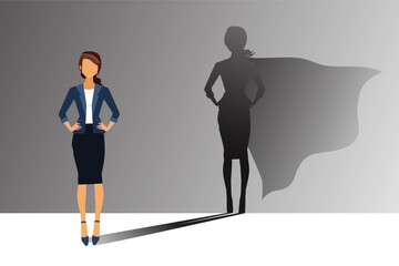 Businesswoman with his shadow of superhero on the wall. Concept of powerful woman.