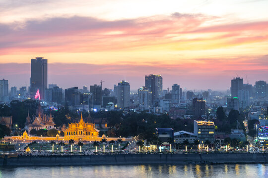 Sunset over Phnom Penh and the Royal Palace,viewed from eastern side of Tonle Sap river,Cambodia.