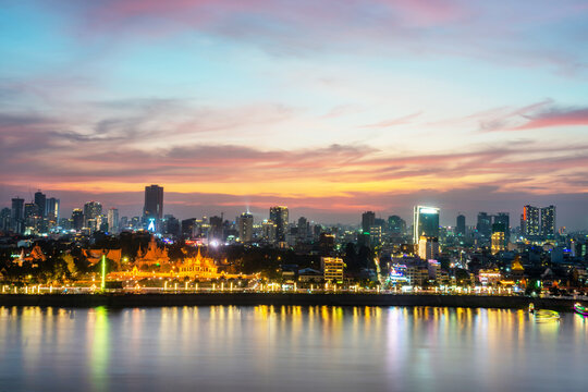 Sunset over Phnom Penh and the Royal Palace,viewed from eastern side of Tonle Sap river,Cambodia.