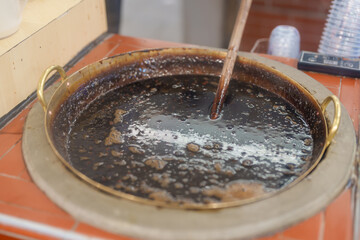 tapioca pearls with brown sugar boba milk tea at night market, famous Taiwanese bubble tea of Taiwan. Street Food and travel in Ximending, Taipei concept