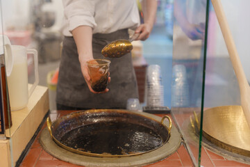 tapioca pearls with brown sugar boba milk tea at night market, famous Taiwanese bubble tea of Taiwan. Street Food and travel in Ximending, Taipei concept