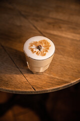 cup of coffee with milk, glass of the cappuccino latte in the cafe