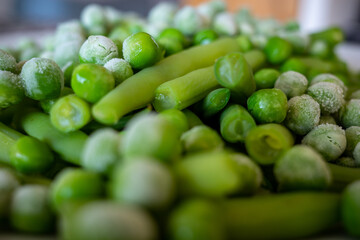 Frozen peas on a plate with greenbeans.
