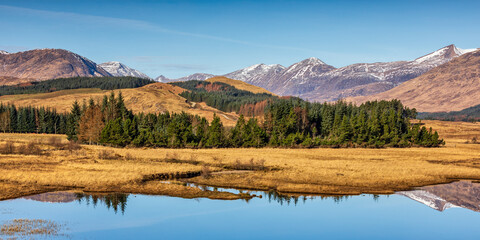 Loch Tulla and its spectacular surroundings on a delightful spring morning, Bridge of Orchy, central highlands of Scotland. - obrazy, fototapety, plakaty