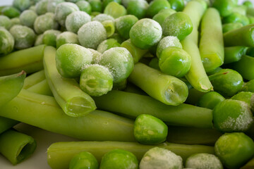 Frozen peas on a plate with greenbeans.