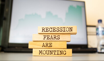 Fototapeta premium Wooden blocks with words 'Recession fears are mounting'.