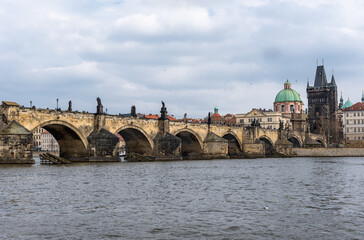 Fototapeta premium River Vltava in Prague, Czech. Charles Bridge and Old Town Water Tower in Background
