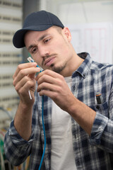 electrician with box of tools seating