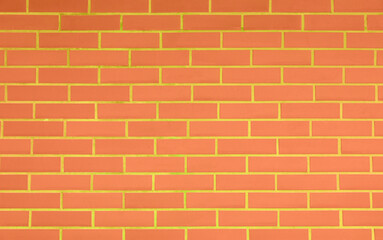 Texture of bright orange brick wall as background