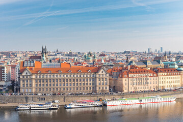 Fototapeta na wymiar Cityscape of Prague, Czech. Vltava river and barge. Colorful Architecture.