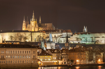 Fototapeta na wymiar Night Cityscape of Prague, Czech. St. Vitus Cathedral, Castle and Palace in Background. Vltava river. Long Exposure. Prague, Czech Republic