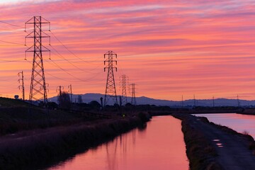 Beautiful view of magnificent power lines in the background of a wonderful sunset