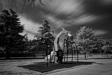 Infrared photography of a of dragon in a playground