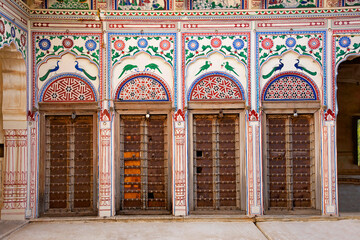 Colorful paintings and wooden windows on the outer wall of Seth Harmukhrai Sanehiram Chokhani...