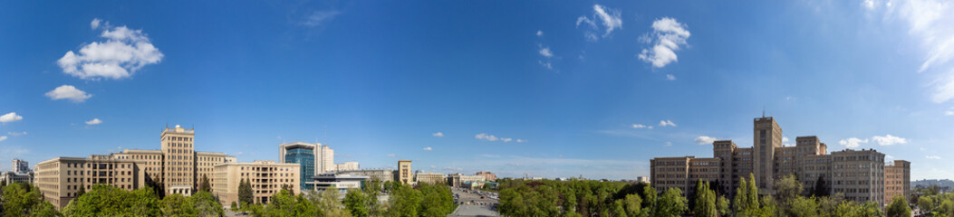 Fototapeta na wymiar Aerial view on Karazin National University buildings on Freedom Square with spring greenery in Kharkiv, Ukraine