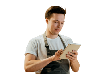 An employee in a uniform apron works accepts an online order on the website, uses a new tablet, transparent background.