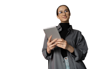 A young woman with glasses in a gray shirt uses a tablet to communicate on a social network, transparent background.