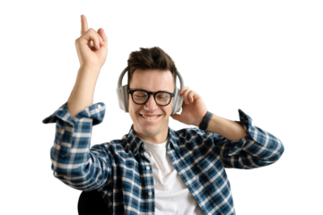 Listening to music with headphones and dancing, a young guy intern with glasses student portrait looks at the camera smiling, transparent background.
