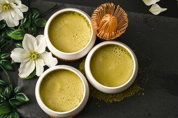 Making matcha tea with a bamboo whisk