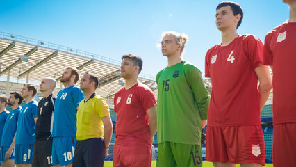 Football Championship: Two Professional Soccer Teams ready for a Stadium Match. Players Shown One by One, Standing in Line. Professional Football Players ready to Win Tournament, Cup. © Gorodenkoff