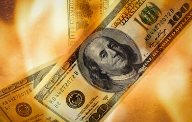 Burning US Dollar bill as a symbol of global world financial crisis