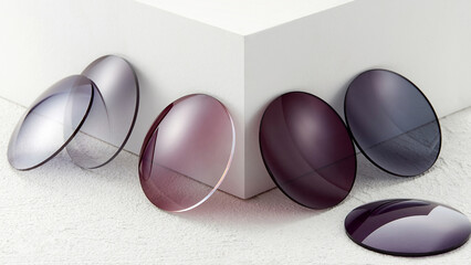 Lenses of glasses, sunglasses lenses of various colors, glass optical lenses taken separately,...