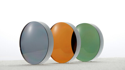 Lenses of glasses, sunglasses lenses of various colors, glass optical lenses taken separately,...