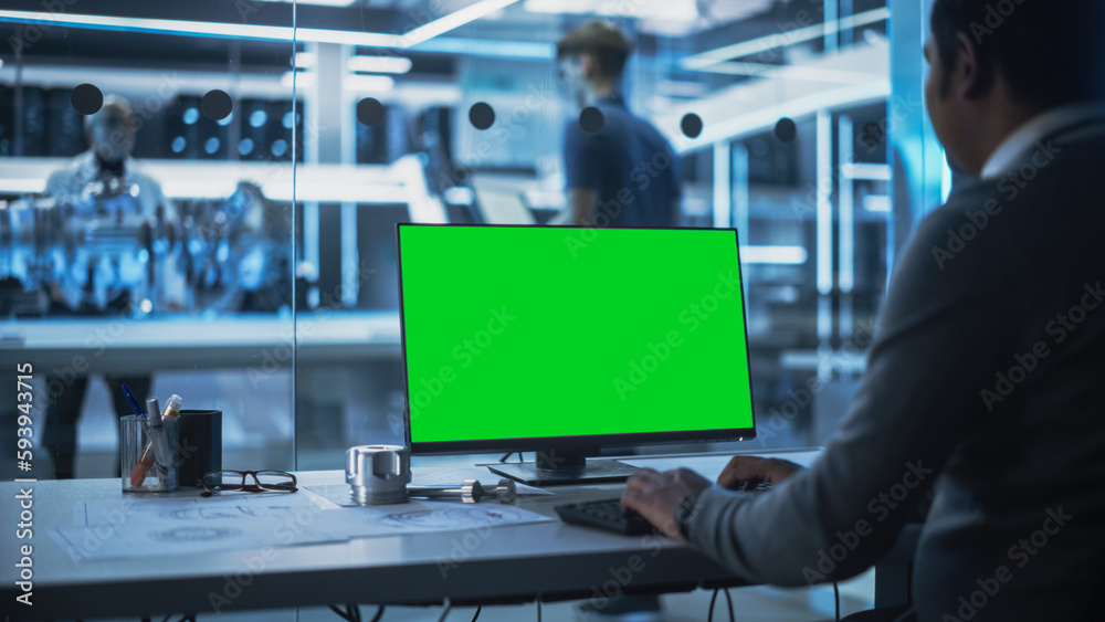 Aufkleber Software Developer Working on Computer with Green Screen Mock Up Display. Scientific Lab, Engineering Research Center with Specialists Working on Turbine Engine Development in the Background.