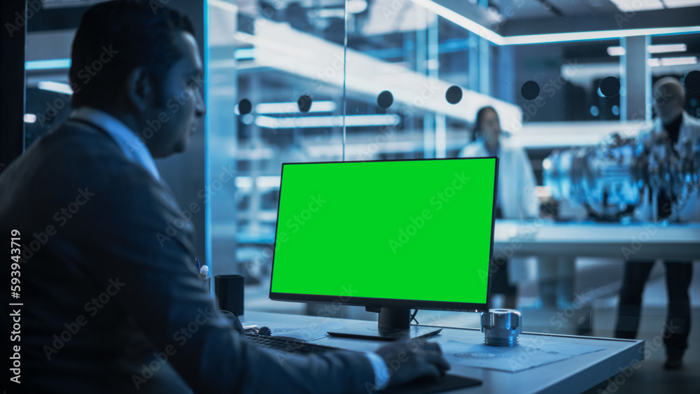 Aufkleber Software Developer Working on Computer with Green Screen Mock Up Display. Scientific Lab, Engineering Research Center with Specialists Working on Turbine Engine Development in the Background.