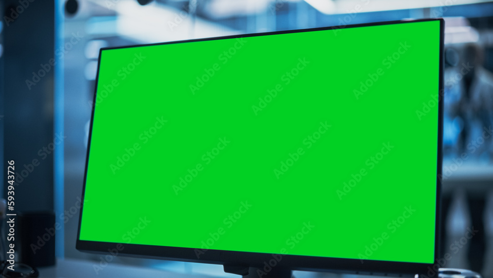 Fototapete Close Up of a Desktop Computer Monitor with Green Screen Mock Up Display Standing in Scientific Research Laboratory Facility.