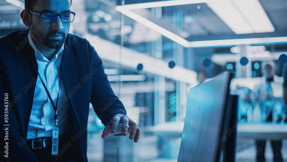 Poster Portrait of Industrial Engineers Discussing Work, Talk and Use Desktop Computer in Turbine Manufacturing Facility. Specialists Researching and Developing Innovative Jet Engine in 3D CAD Software.