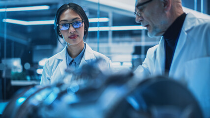 Diverse Team of Diverse Multicultural Engineers Use a Testing Device, Analyze and Discuss How a...