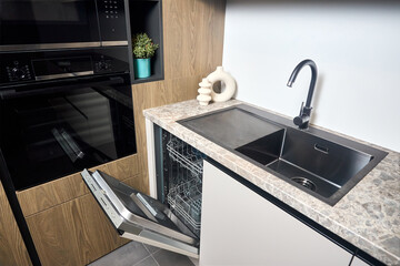 Urban rustic loft style kitchen interior in wooden facade and stoneware countertop tabletop with...