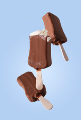 popsicle in chocolate icing on a blue background, flying food