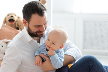 Obraz premium Father with his child son play together at home