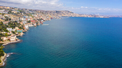 Fototapeta na wymiar Aerial view of Posillipo waterfront in Naples, Italy. The neighborhood overlooks the Mediterranean Sea.