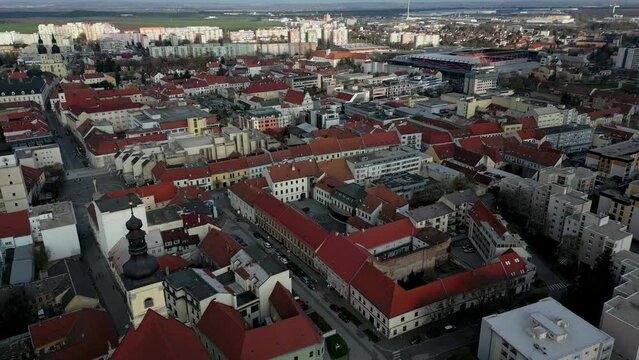 Stunning aerial view of Trnava old town district, Saint Nicolas Church, 4k
