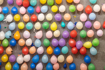 Colorful balloons on a wall of a booth