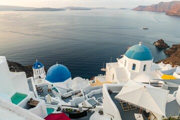 Famous Santorini blue domes and Aegean ocean