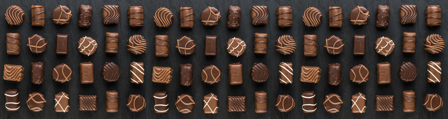 Bonbon Chocolate Pralines Texture Background, Cocoa Candies Banner, Chocolate Praline on Black