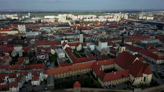 Aerial footage of Trnava, old town district, view of Saint Nicolas Church, 4k