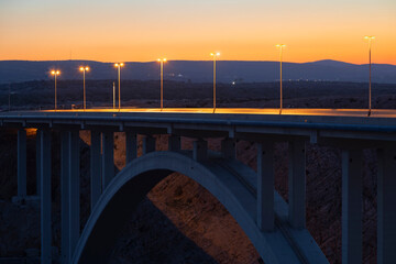 streetlights on the Maslenica bridge after sunset