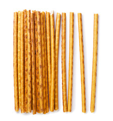 Pretzel sticks scattered on a white background. Top view