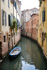 Venice: landscape with the image of boats on a channel in Venice, Italy