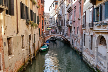 Naklejka na ściany i meble Venice: landscape with the image of boats on a channel in Venice, Italy